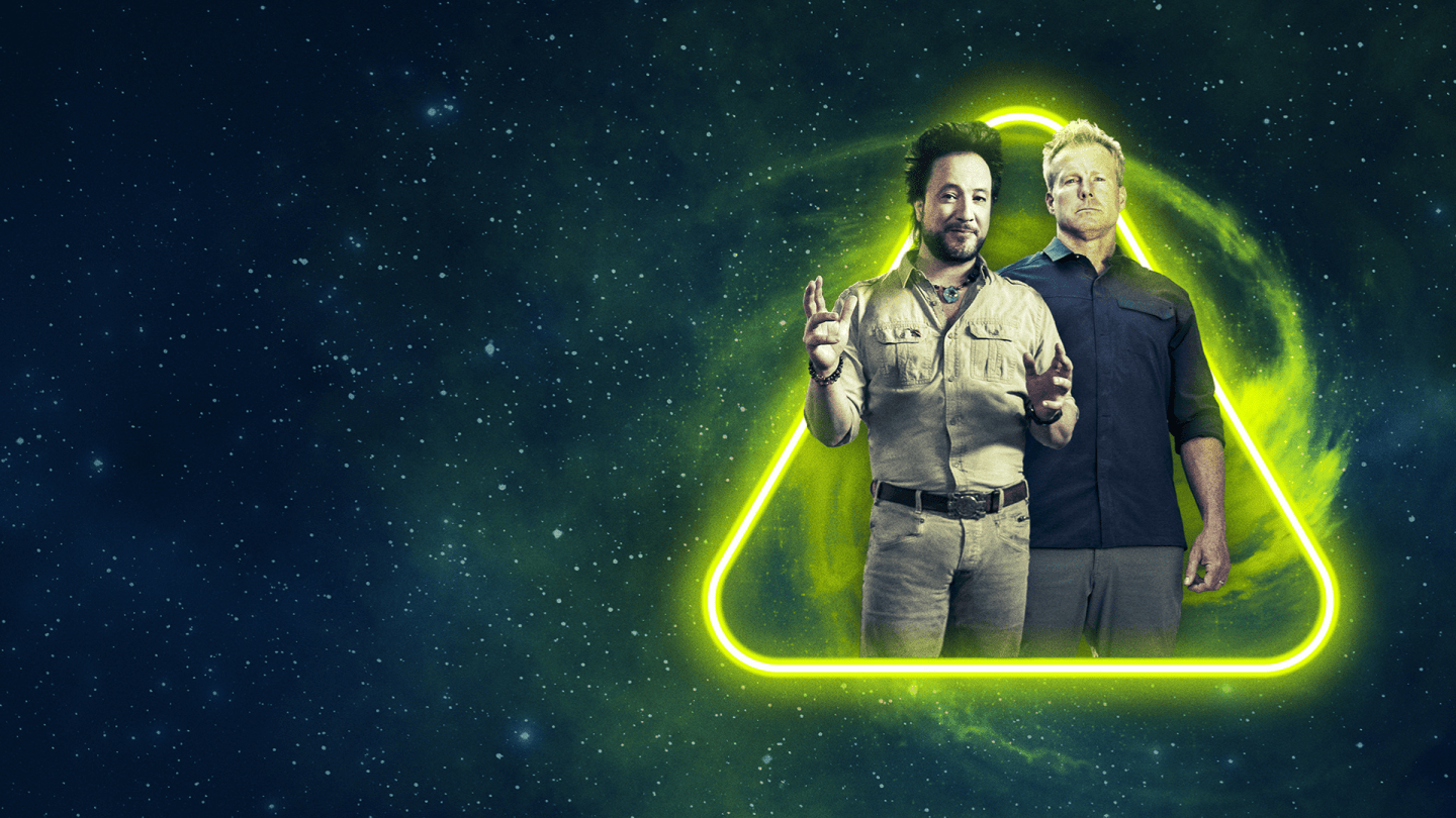 Two individuals stand inside a glowing neon-yellow triangle set against a dark, starry space backdrop. There is no text on this version.