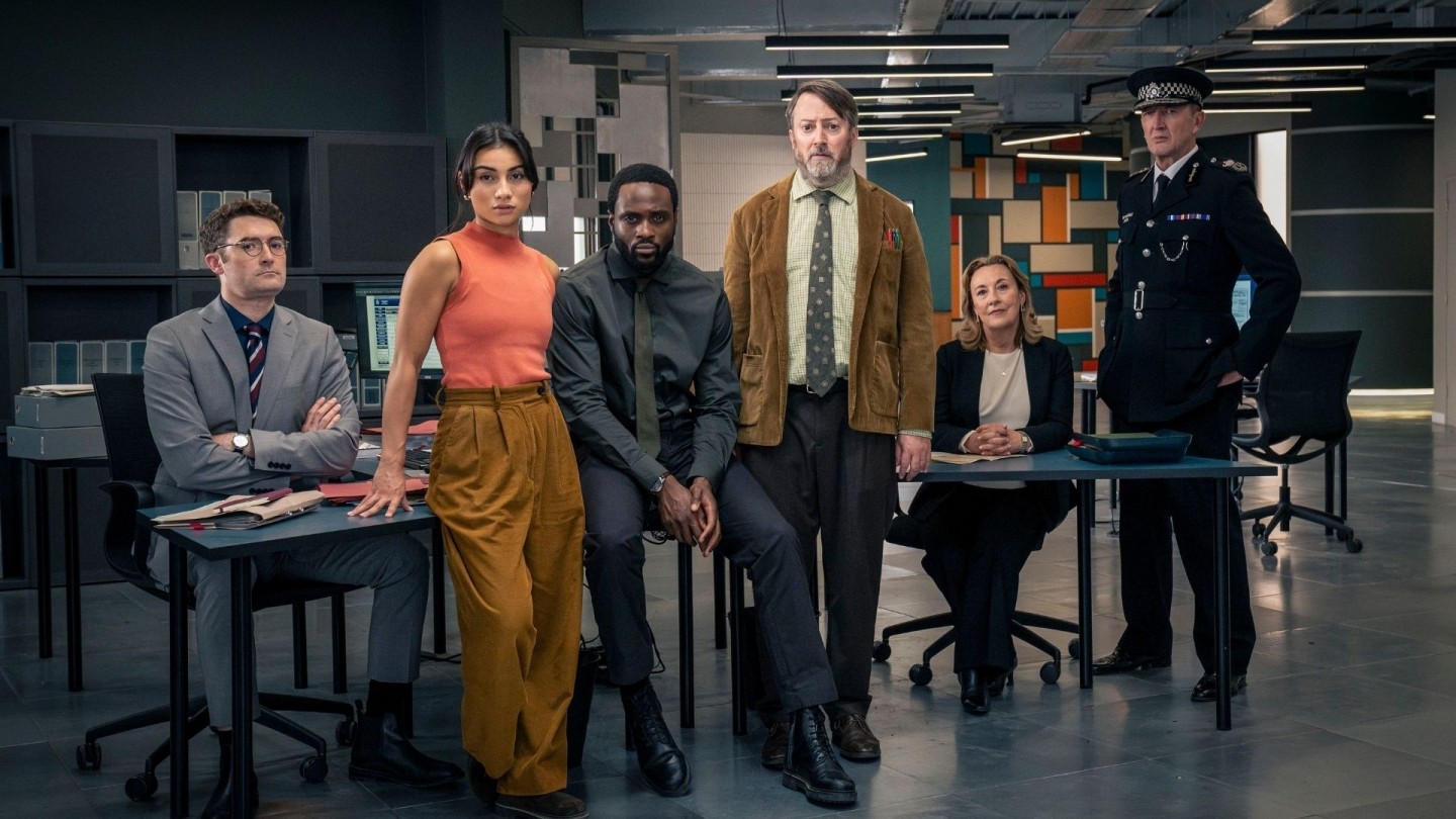Promotional image for Ludwig featuring the investigative team inside a modern police headquarters during a complex criminal investigation.