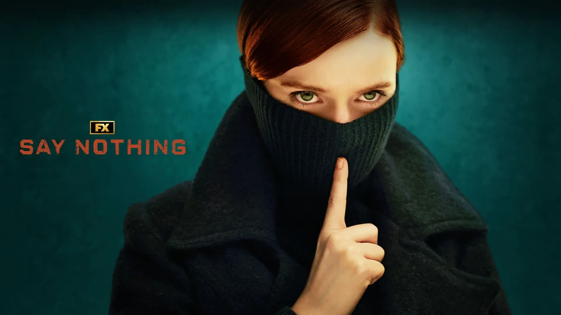 A women with auburn hair and green eyes stood with half her face covered behind a scarf and her finder against where her lips would be staring into the camera