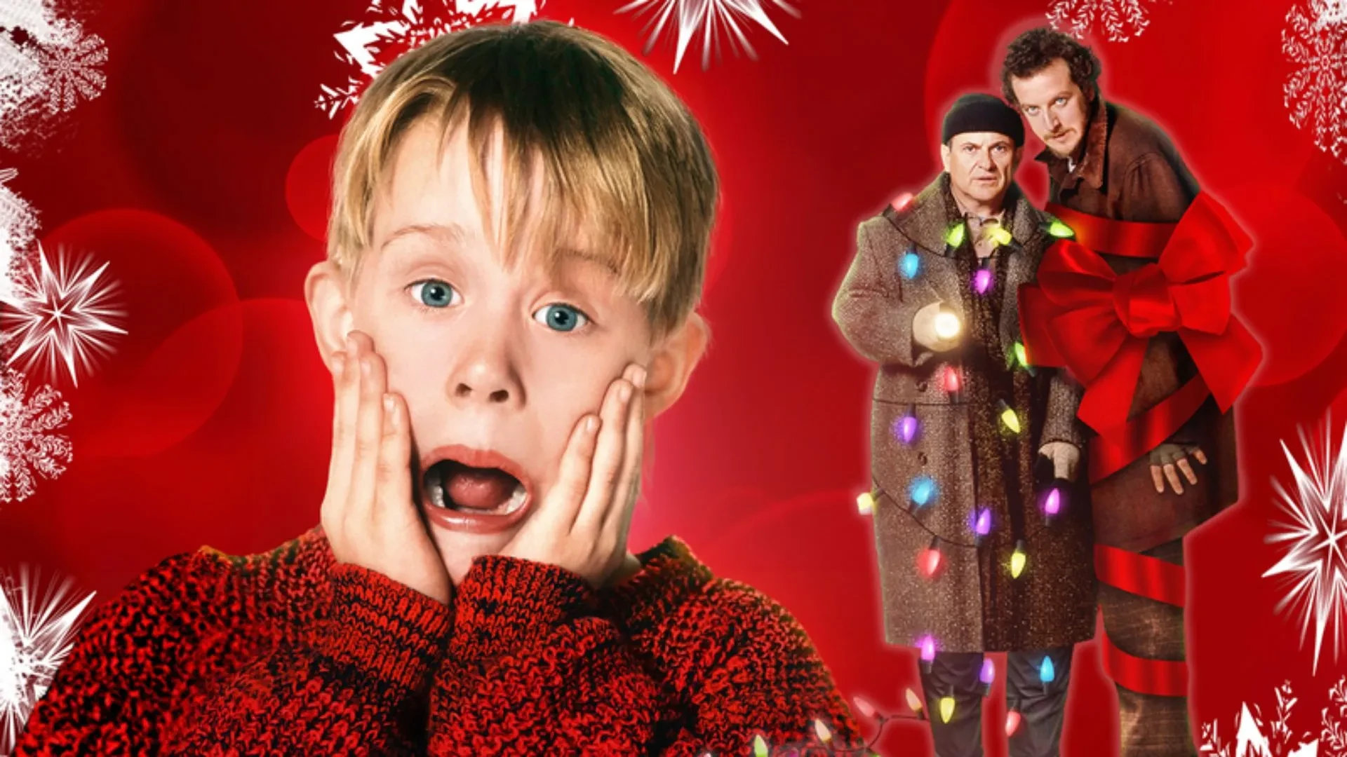 Festive red background with a child in a holiday sweater and two adults wrapped in Christmas lights and a giant bow.