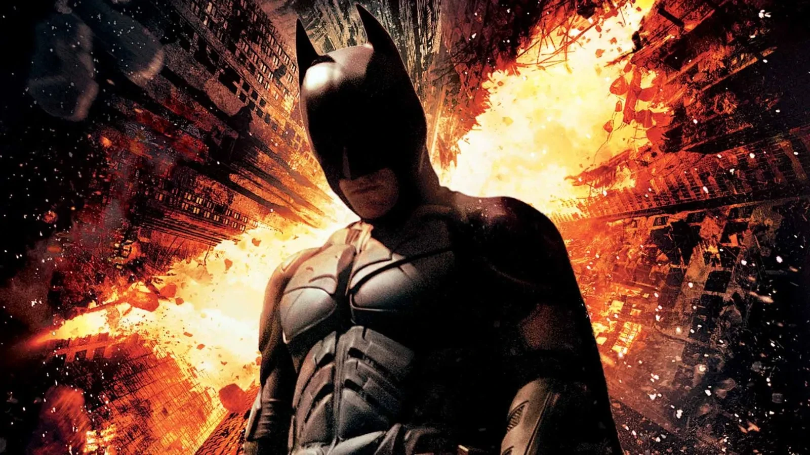 Poster image for The Dark Knight Rises (2012), showing Batman standing in front of a fiery bat-shaped explosion against a dark, crumbling city backdrop.