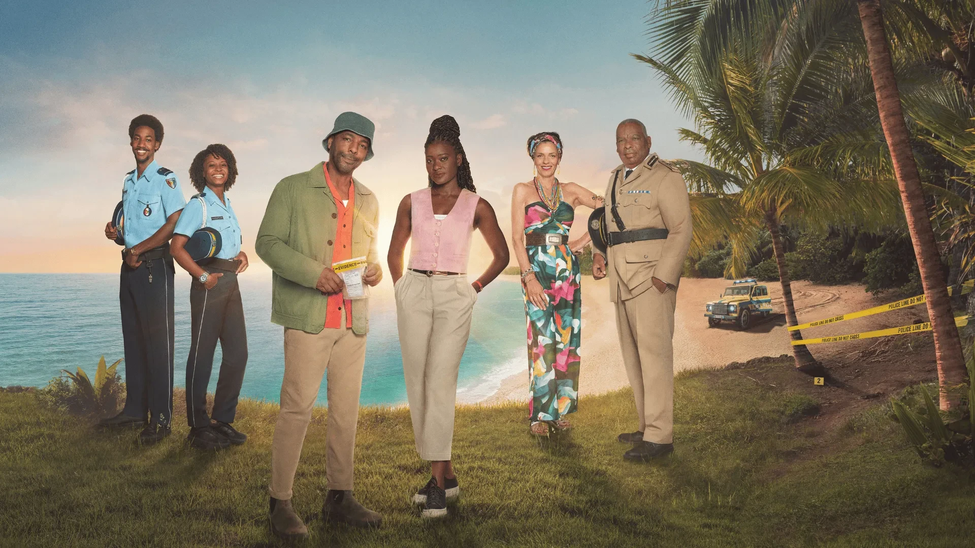 Group of detectives and officers standing on a tropical beach with police tape and a patrol vehicle in the background.