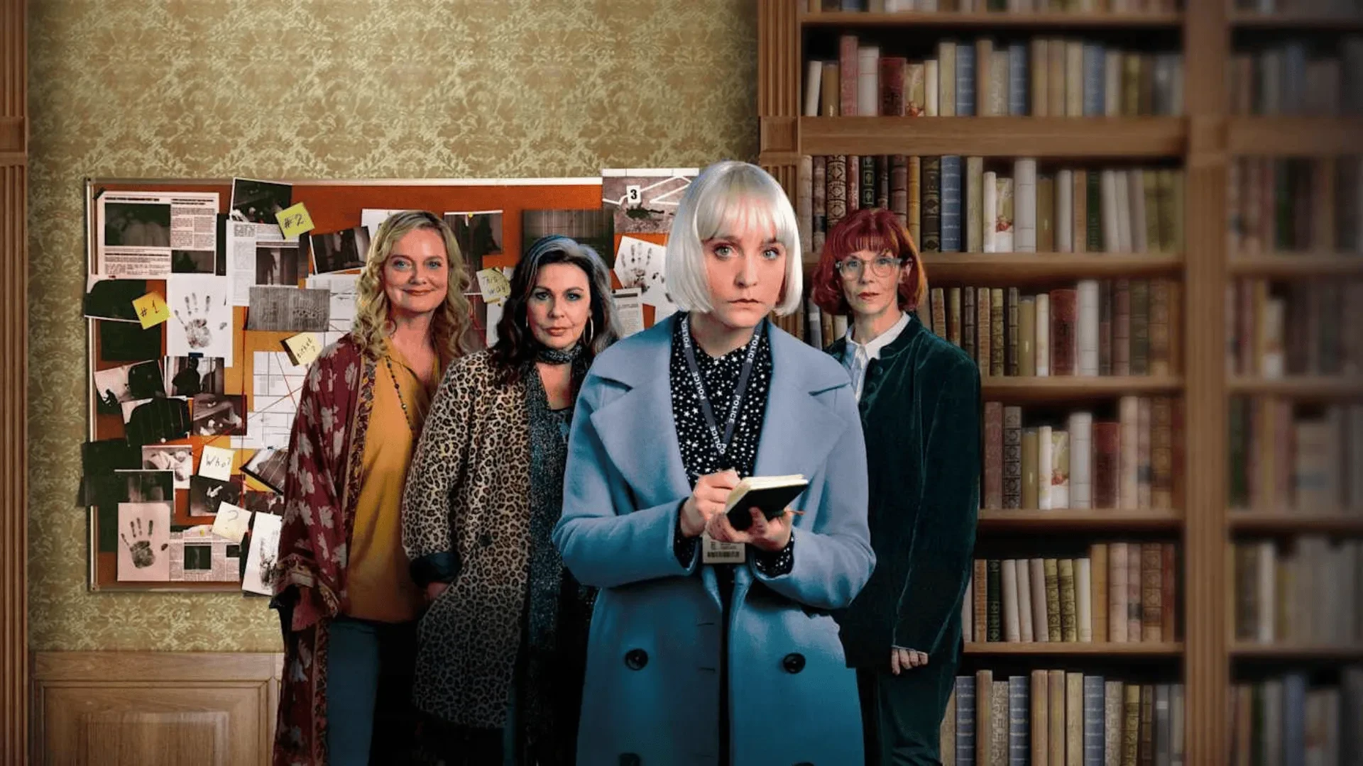 Group of investigators standing in a library, with one person writing in a notebook while a detailed evidence board filled with photos and notes is displayed on the wall behind them.