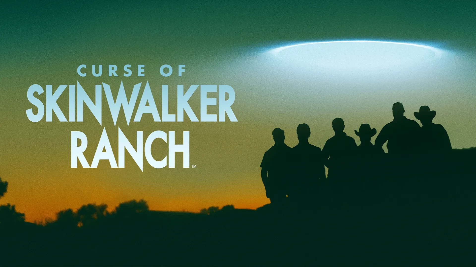 A group of silhouetted individuals stand on a hillside at sunset, looking toward a bright, circular light formation in the sky. The title “CURSE OF SKINWALKER RANCH” appears on the left.