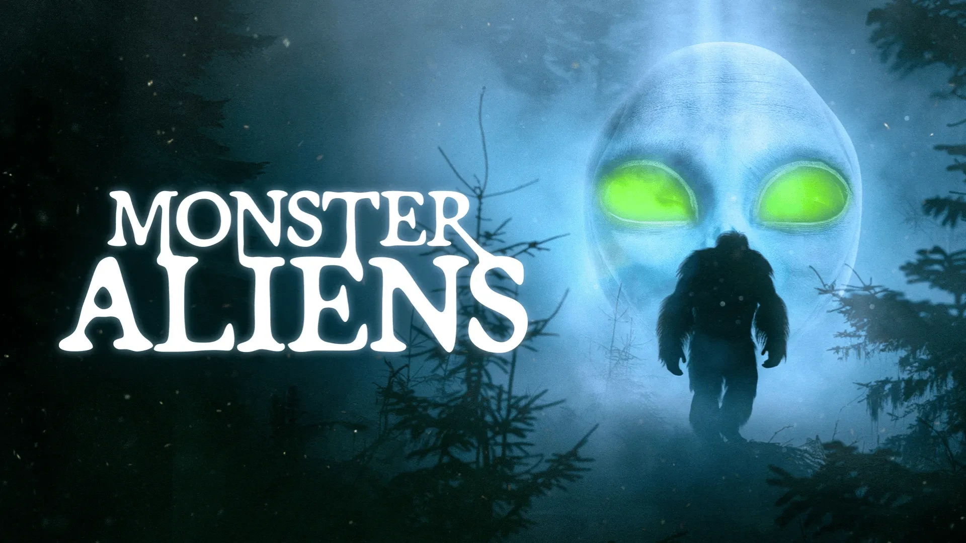 A glowing blue light illuminates a forest at night. A large alien face with bright green eyes appears in the mist, while a silhouetted creature stands among the trees. The text “MONSTER ALIENS” is displayed on the left.