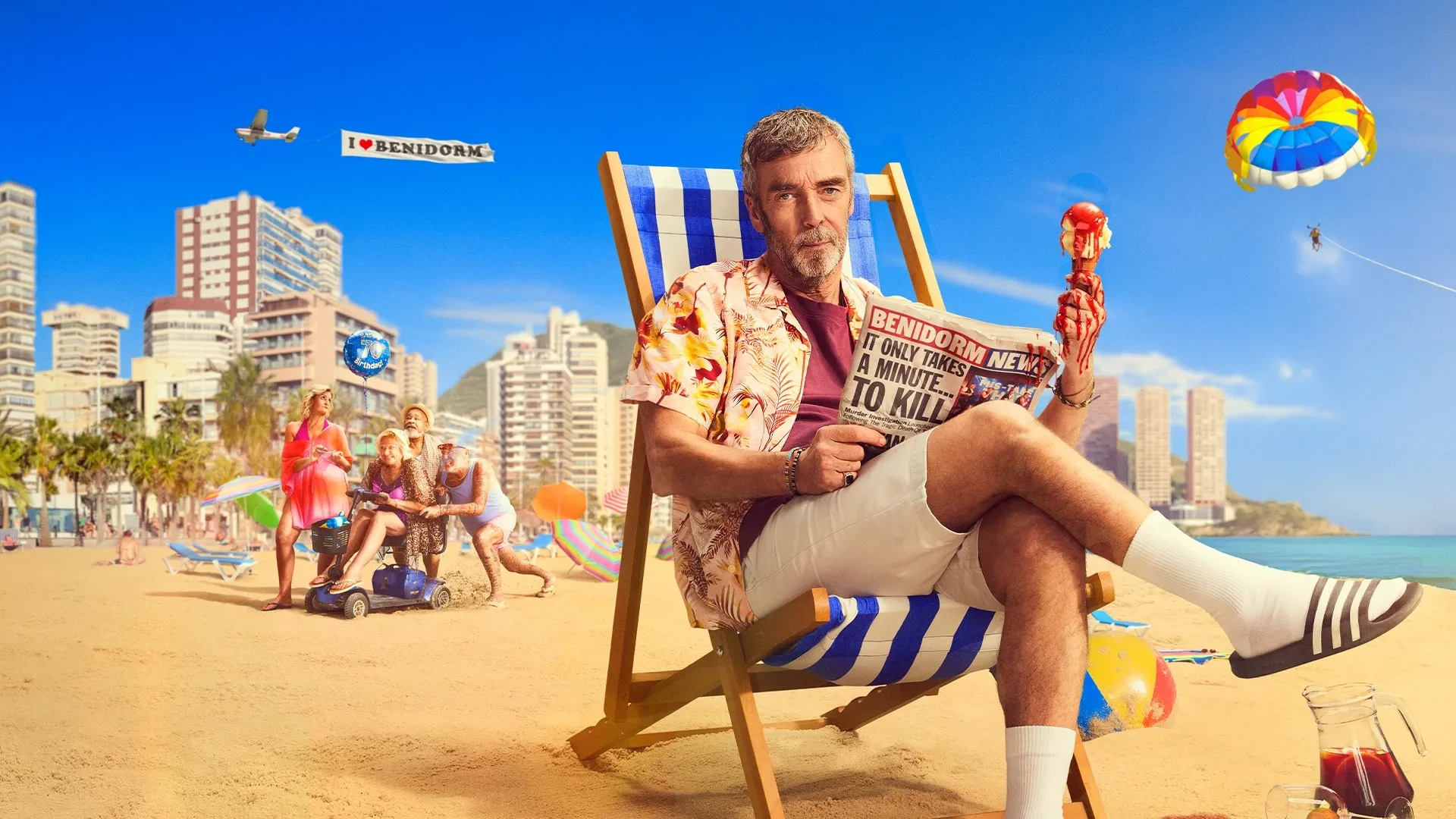 Promotional image for the TV series A Town Called Malice, showing a man in a floral shirt on a beach deckchair holding a bloody ice cream cone and newspaper