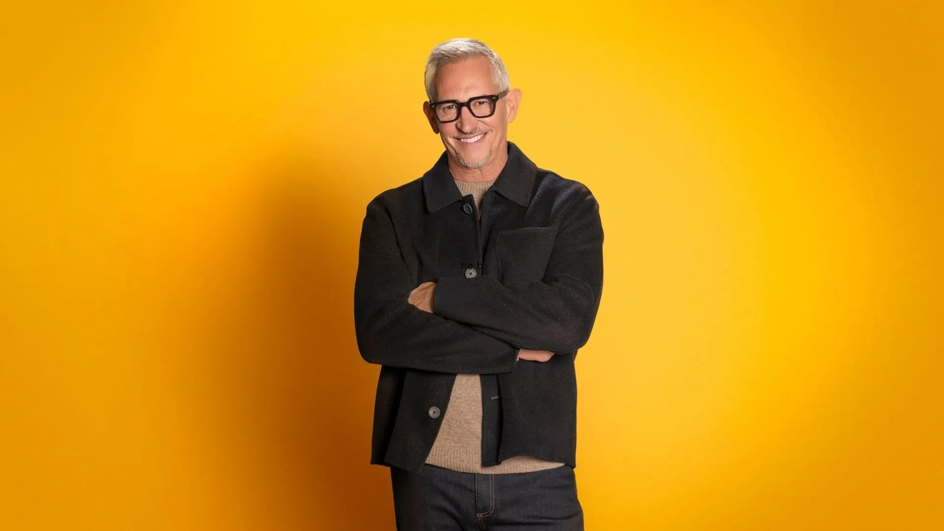 Official promotional image for The Box featuring the show's presenter against a vibrant yellow background.