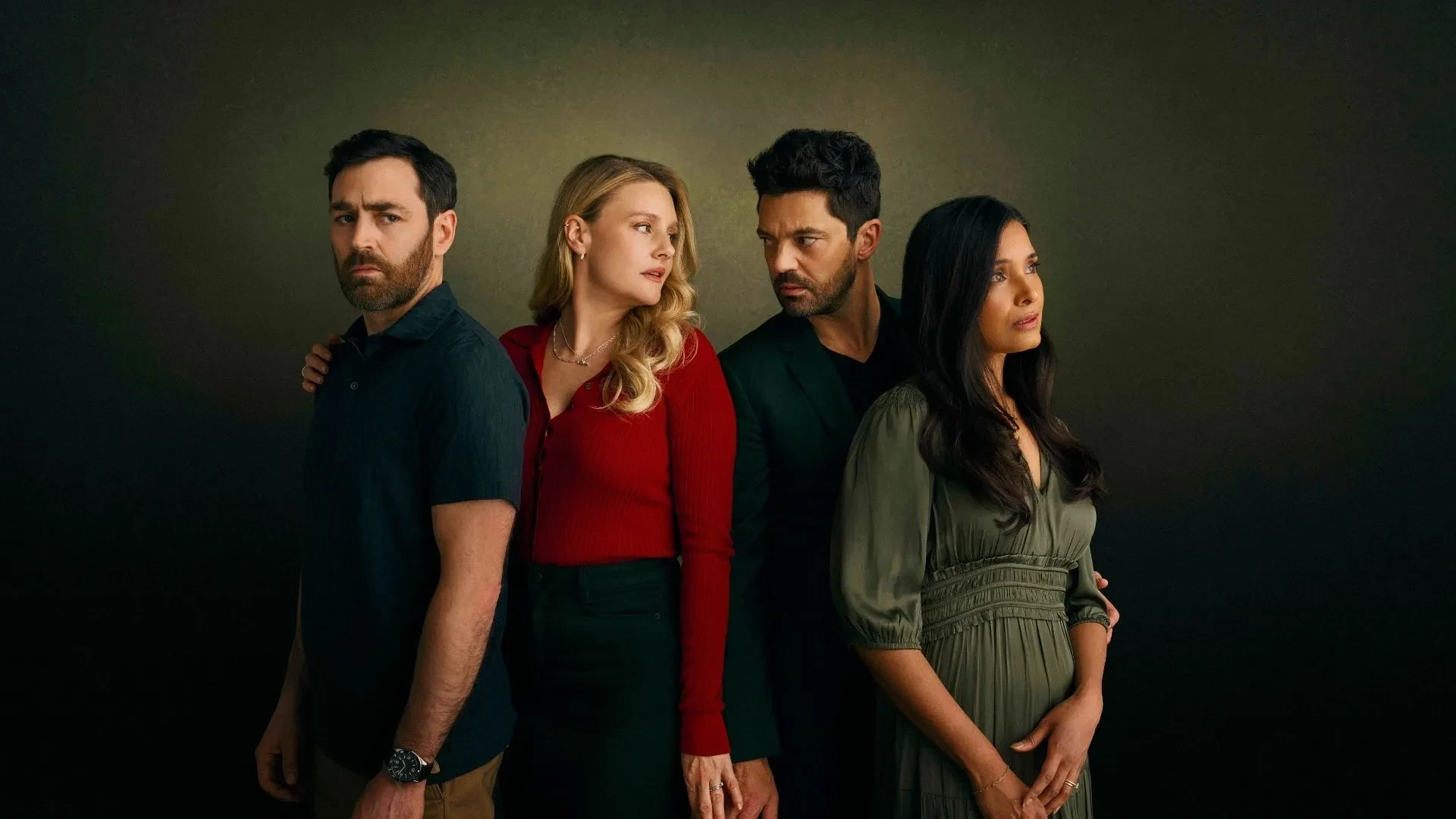 Two couples wearing dark colours with a man and women stood in the middle discreetly holding hands. Key art for ITVs drama Adultery.